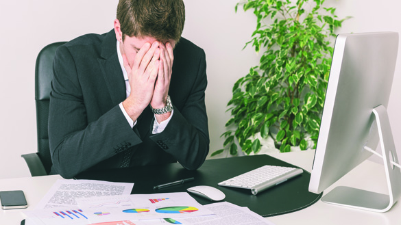 Stressed Young Businessman at Office