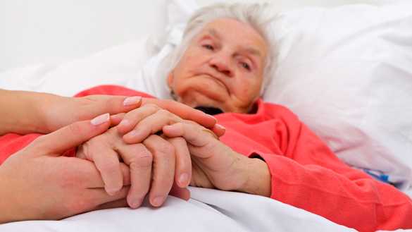 Elderly woman with her caregiver at home