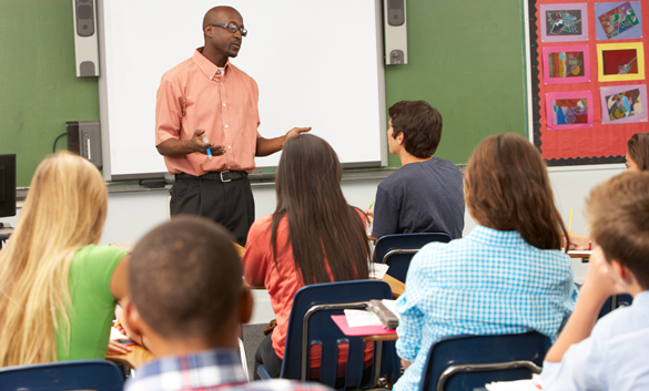 Teacher Using Interactive Whiteboard During Lesson