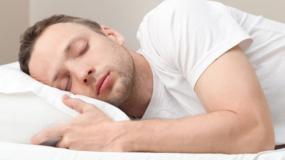 Portrait of sleeping Young Caucasian man in white