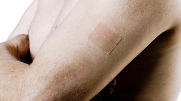 Man arm with healing patch