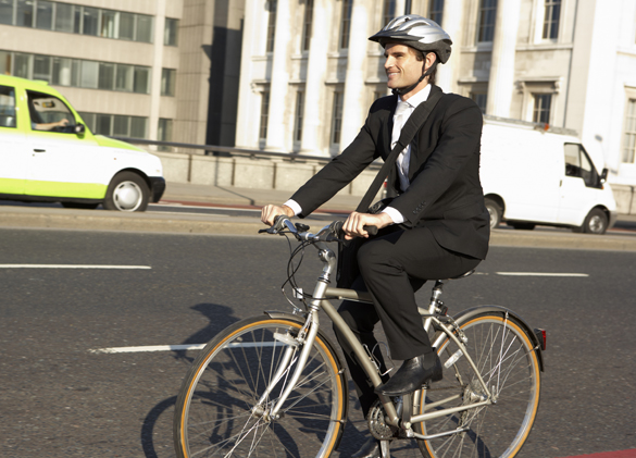 Businessman cycling to work