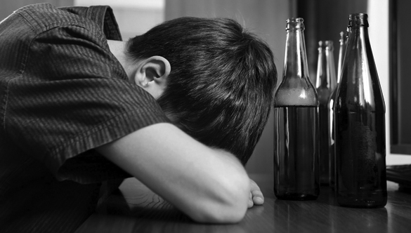 59402395 - tired young man with bottle of the beer at the home