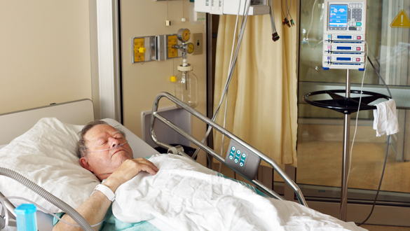 Senior man in hospital bed