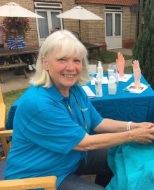 jackie at event giving treatment